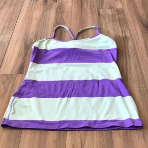 The brand is ivivva and the colours are purple and a light blue